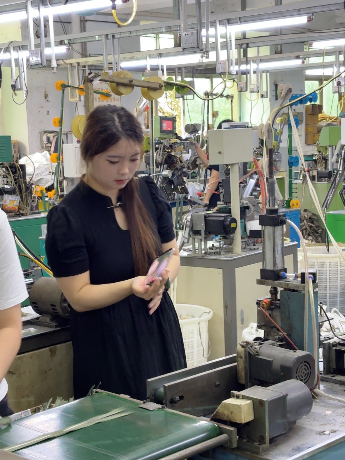 Operator inspecting zipper components