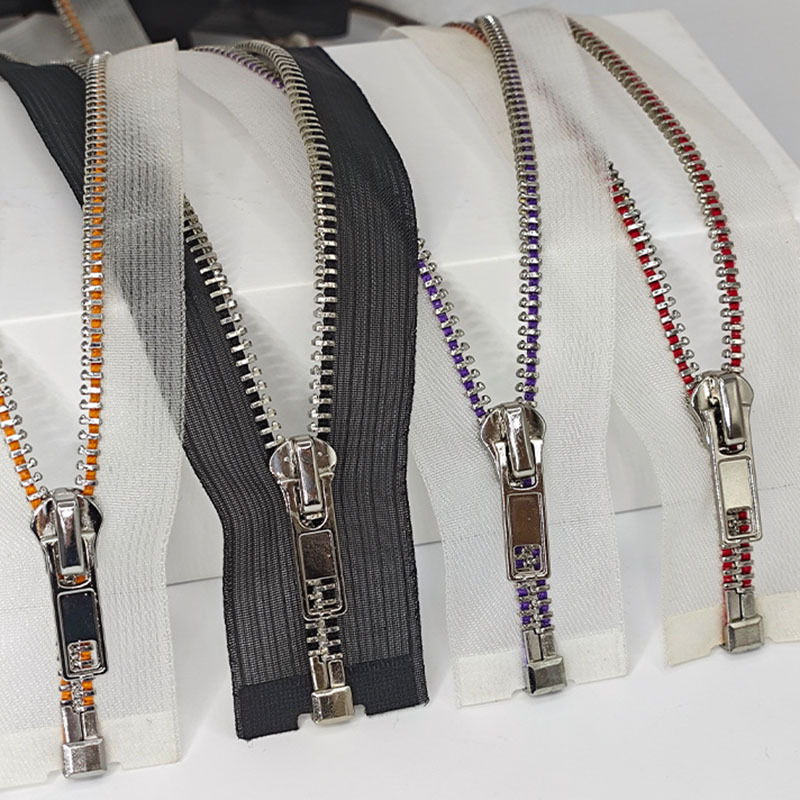 Metal teeth and decorative zipper finishes